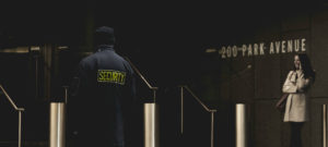 Photo of security guard at an office entrance
