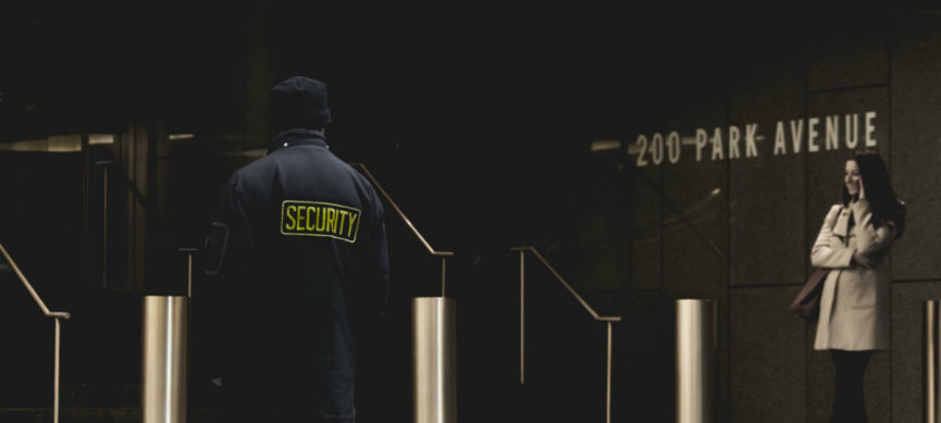 Photo of security guard at an office entrance